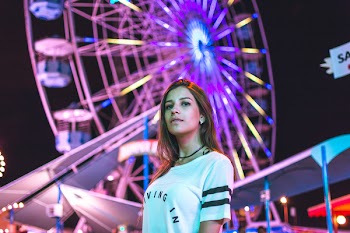 Low-angle Photography of Female on Carnival