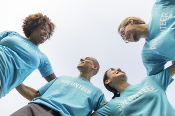 Low Angle Photography Of Four People 