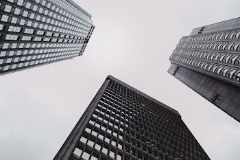low angle photography of glass buildings