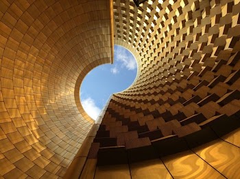 low angle photography of gold-colored building during daytime