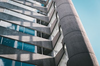 low-angle photography of gray and white concrete building