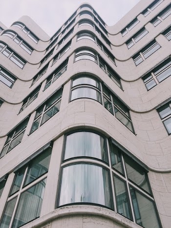 Low Angle Photography of Gray Concrete Building at Daytime