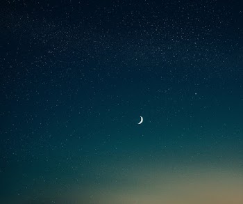 low-angle photography of half moon