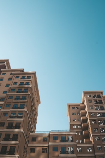 Low Angle Photography of High-rise Buildings Under Blue Sky