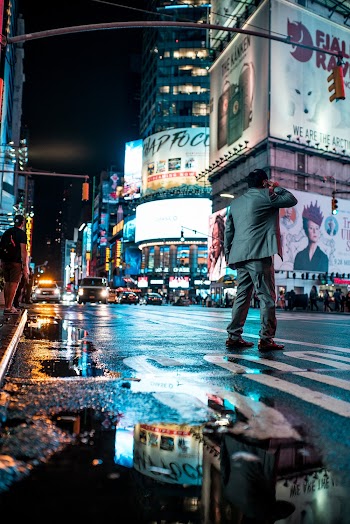 Low Angle Photography of Man on City Crossing Street
