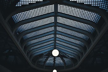 low angle photography of mesh wall