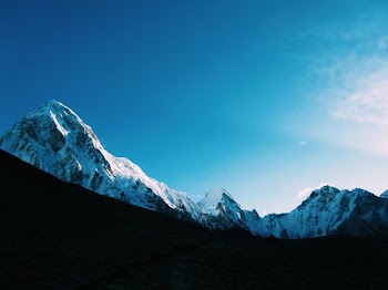 low angle photography of mountain covered by snow