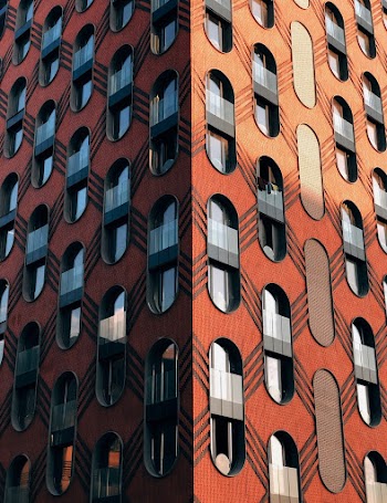 Low-angle Photography of Orange and Gray High-rise Building