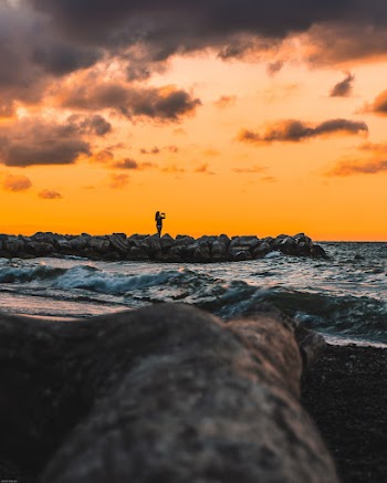 Low-Angle Photography of Person Standing on Rocks