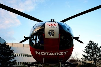 Low-angle Photography of Red and Black Notarzt Helicopter