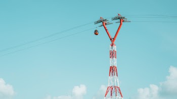 Low Angle Photography of Red and White Utility Tower