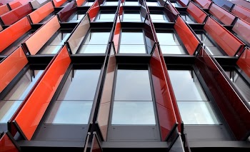 Low Angle Photography of Red Metal Building