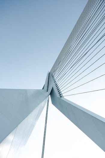 low angle photography of tower with wires during daytime