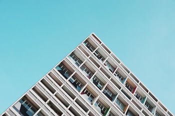 low-angle photography of white concrete building