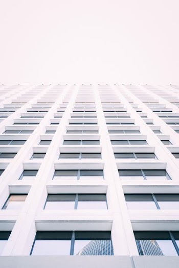 low-angle photography of white concrete building