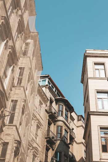 Low Angle Photography of White Concrete Buildings