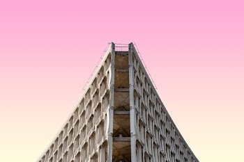 low angle photography of white concrete high-rise building