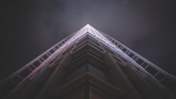low-angle photography of white high-rise state of the art building
