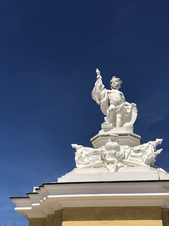 Low Angle Photography Of White Human Figure Statue