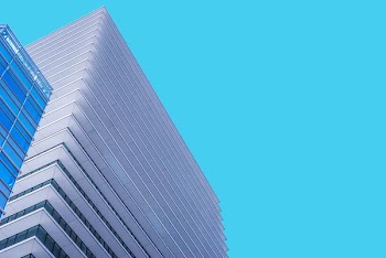 low angle photography of white painted building