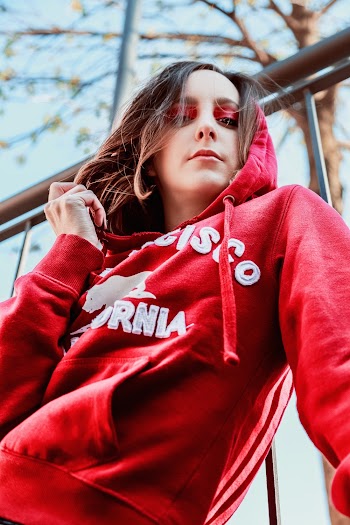 Low Angle Photography of Woman Wearing Red Hoodie