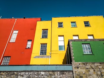 Low-angle Photography of Yellow and Orange Concrete Houses