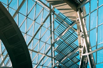 Low Angle Shot From Inside Of A Modern Building With Steel And Glass Panels Exterion