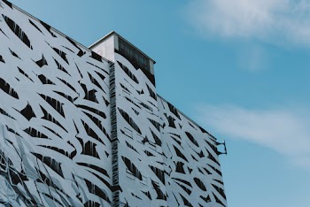 Low Angle Shot Of A Building Exterior With Abstract Design
