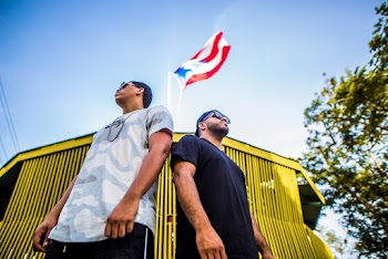 Low Angle Shot Of Two Men in White and Black T-shirts W