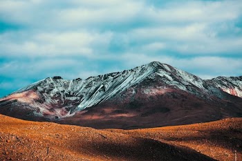 low angle-view of brown soil near mountain