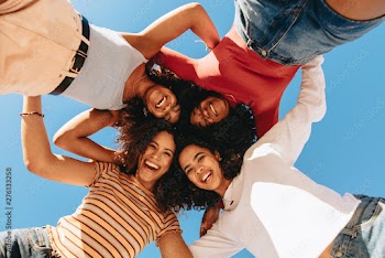 Low angle view of four smiling women