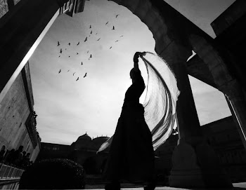 Low Angle View of Silhouette of Woman Standing Near Building