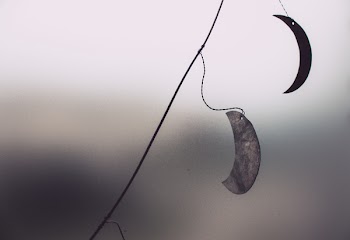 Low Angle View of Two Crescent Moon Cutout Hanging Decors