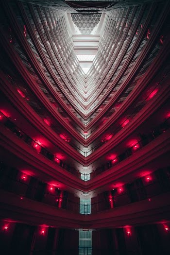 low-angled photography of building interior with red lights