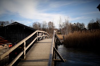 Low Light Photography of Bridge Leading to Grass Field