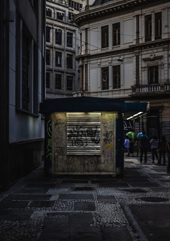 Low Light Photography of People Walking Near Building