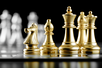 Luxurious Golden Chess Pieces on Glossy Board