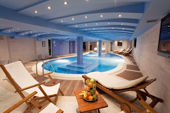 Luxury resort swimming pool with beautiful clean blue water and nice light effects around it.