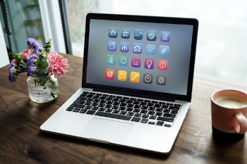 Macbook on Brown Surface