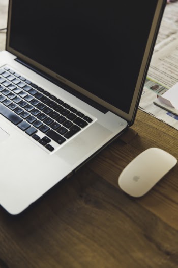 Macbook Pro Beside the Apple Magic Mouse
