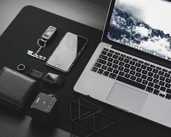 MacBook Pro on top of desk