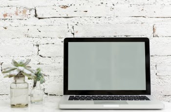 Macbook Pro on White Surface