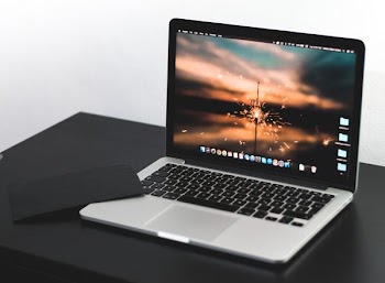 MacBook Pro on wooden table