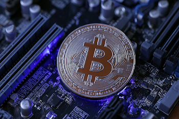 Macro Close-Up of Bitcoin on Motherboard with LED Glow