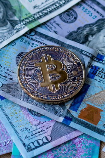 Macro Close-Up of Cryptocurrency Coin on Currency Notes