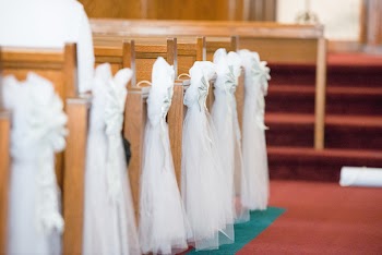 Macro Photo of White Textile Near Chairs
