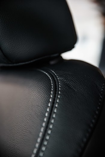 Macro Photography of Black Leather Seat