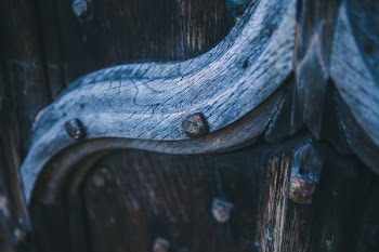 Macro Photography of Brown Wooden Board With Carvings