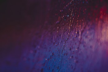 Macro Photography Of Raindrops On Glass