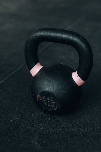 macro shot of black kettlebell on floor